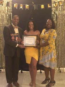 Raenel Crenshaw (center), a standout scholar-athlete at Bluefield State College, was presented the “2019 Arthur Ashe Jr. Sports Scholar Award,” sponsored by the magazine “Diverse: Issues in Higher Education” during the College’s recent athletics banquet. Ms. Crenshaw is pictured with Dr. Guy Sims (left), Assistant to the President/BSC Office of Equity, Diversity, Inclusion & Title III, and Andrea “Omi” Oakes, BSC Head Women’s Volleyball Coach.