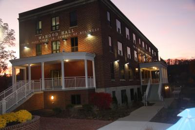 Mahood Hall, home of the W. Paul Cole, Jr. School of Business at twilight