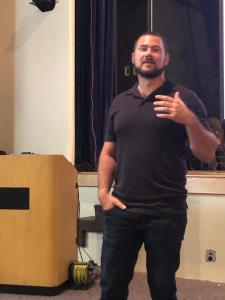 Daniel Alarik, creator of Grunt Style Clothing, speaks at Bluefield State College during "Wolf Pack," a two-day workshop for professionals in criminal justice, law enforcement, and related fields.