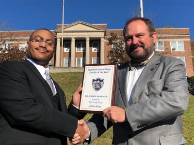 Bluefield State College Professor of History Dr. Rodney Montague (left) was selected to BSC’s faculty as the College’s “Faculty of the Year, 2019-2020” award recipient.  He is pictured with Dr. Ted Lewis (right), Bluefield State College Provost, who formally presented the award.
