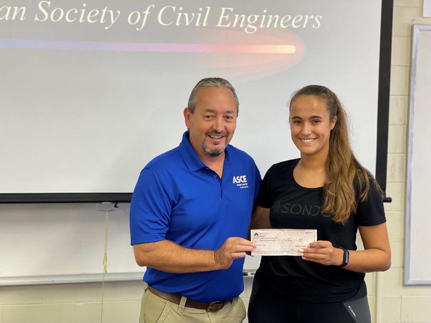 Bluefield State College student Virginia Zanotti (right) is pictured with Dr. Kerry Stauffer, BSC Engineering Technology faculty member as he presents the “Claude B. Dalton Scholarship” to her.  Zanotti was also honored as BSC’s “Top Engineering Technology Freshman.”