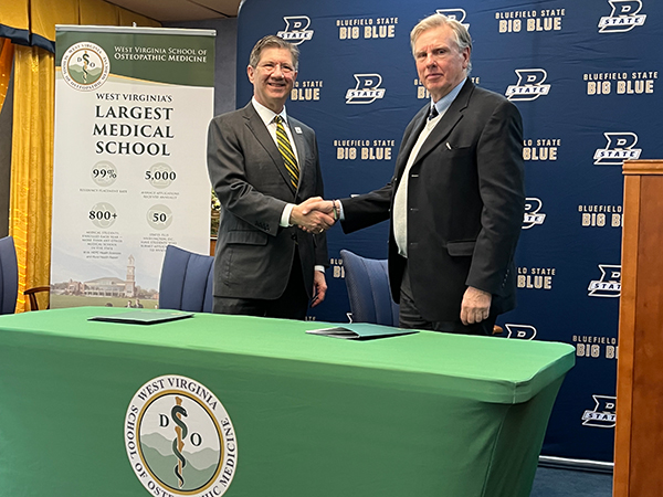 West Virginia School of Osteopathic Medicine President James Nemitz (left) and Bluefield State University President Robin Capehart are pictured moments after signing a memorandum of understanding focused on more thoroughly preparing BSU students aspiring to pursue a career in osteopathic medicine.