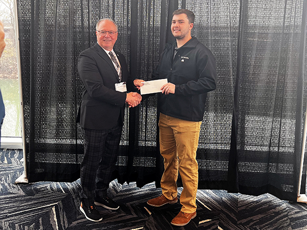 Bluefield State University student Chase Belcher (right) is pictured with Gene Thompson, chair of the WV Contractors Association (WVCA) Scholarship Fund Foundation during a recent scholarship presentation ceremony.  Belcher was selected by the Foundation to receive a $3,000 scholarship.